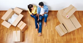 man and woman with boxes